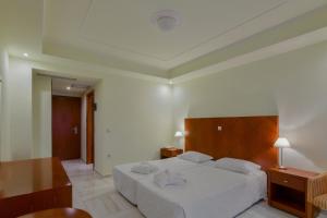 Postel nebo postele na pokoji v ubytování Nefeli Hotel
