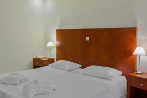 Postel nebo postele na pokoji v ubytování Nefeli Hotel