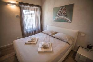 Posteľ alebo postele v izbe v ubytovaní Relais Madergnago