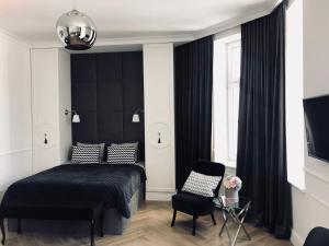 Posteľ alebo postele v izbe v ubytovaní Apartament 51 z miejscem parkingowym