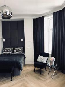 Posteľ alebo postele v izbe v ubytovaní Apartament 51 z miejscem parkingowym