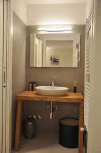 a bathroom with a sink and a mirror at Madonna del Mare in Trieste