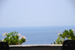 
a view from a balcony of a beach with a view of the ocean at Maristella in Positano
