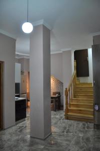 a room with a staircase and a stair case at Old Tbilisi Rhymes in Tbilisi City