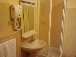 a bathroom with a sink and a shower and a mirror at B&B Il Parco Dei Pini in Giulianova +40 photos