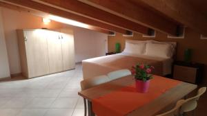 Postel nebo postele na pokoji v ubytování Residence Ilario Suite Hotel