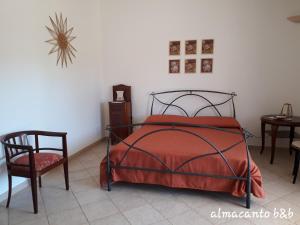 A bed or beds in a room at Almacanto B&B