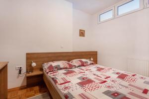 Postel nebo postele na pokoji v ubytování Apartma Luna