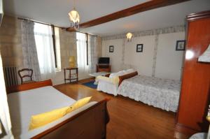 Postel nebo postele na pokoji v ubytování La Riviere