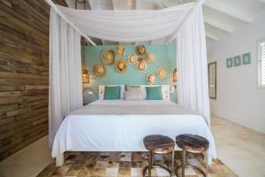 Tempat tidur dalam kamar di Mahona Boutique Hotel