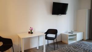 TV a/nebo společenská místnost v ubytování Beachfront Studio Palma