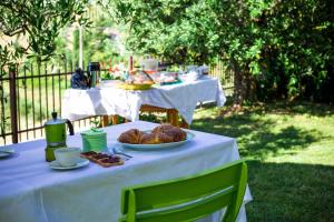a table with a plate of food on it at B&B Terramare in Castorano