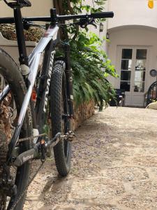 a bike parked in front of a building at Sa Voga Hotel & Spa in Arenys de Mar