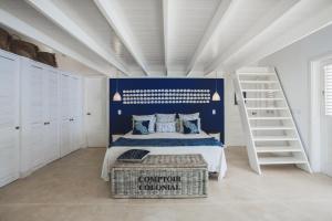 Tempat tidur dalam kamar di Mahona Boutique Hotel