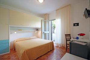 מיטה או מיטות בחדר ב-Hotel La Stella