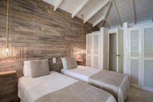 Tempat tidur dalam kamar di Mahona Boutique Hotel