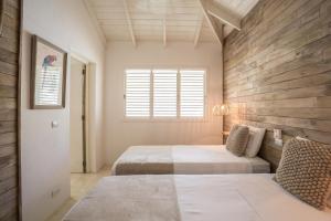 Tempat tidur dalam kamar di Mahona Boutique Hotel