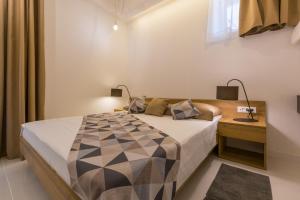 Postel nebo postele na pokoji v ubytování Boutique Apartments "7 Angels"