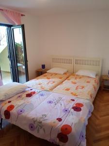 Postel nebo postele na pokoji v ubytování Apartment Monfiorenzo 11