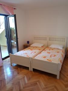 Posteľ alebo postele v izbe v ubytovaní Apartment Monfiorenzo 11