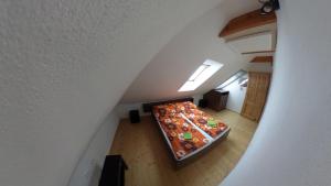 an overhead view of a room with a bed in a attic at Ubytování Mikulov in Mikulov