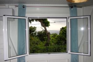 Fotografie z fotogalerie ubytování Or bleu-Bungalow volcan Soufriere-Vue sur mer v destinaci Saint-Claude