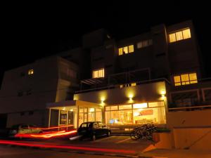 a car parked in front of a building at night at Atlántico Boutique Hotel in Punta del Este