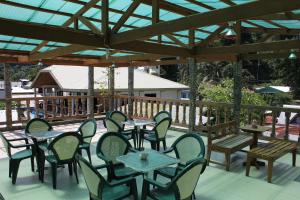 a group of tables and chairs on a patio at Aqua Travel Lodge in El Nido