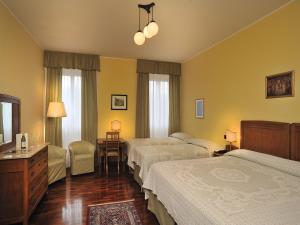 Tempat tidur dalam kamar di Albergo San Domenico