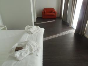 Voodi või voodid majutusasutuse Albergo Dongo toas