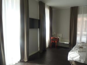 Voodi või voodid majutusasutuse Albergo Dongo toas