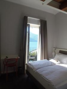 Voodi või voodid majutusasutuse Albergo Dongo toas