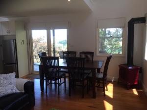 a dining room with a table and chairs at Haven Villa in Berry