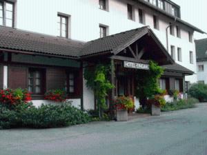 a hotel with a sign on the front of a building at Regerhof in Germering