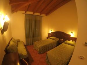 Ein Bett oder Betten in einem Zimmer der Unterkunft Hotel Barabba