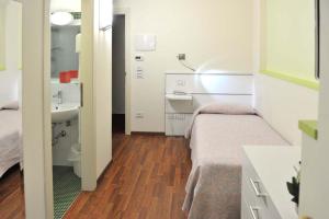 Postel nebo postele na pokoji v ubytování Hotel Benessere Villa Fiorita