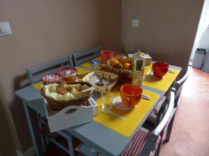a blue table with food on top of it at maison floréal in Criel-sur-Mer