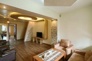 a living room with a couch and a table at Luxury Apartments in Center in Yerevan