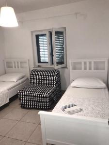 Postel nebo postele na pokoji v ubytování Guesthouse Davorka Bijelić