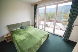 Voodi või voodid majutusasutuse Hotel Rakitna toas