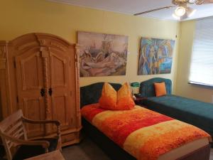 מיטה או מיטות בחדר ב-Felixanum Hotel & Galerie