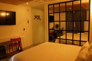 Postel nebo postele na pokoji v ubytování SOYU Hotel