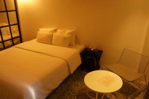 Postel nebo postele na pokoji v ubytování SOYU Hotel