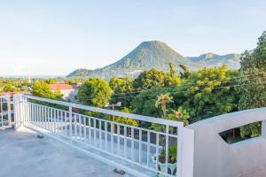 a balcony with a view of a mountain at Berlian Hotel in Ende