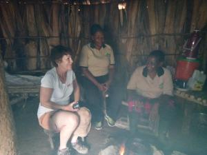 a group of people sitting in a cabin at Machame Nkweshoo Cultural Tourism in Machame