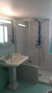 a bathroom with a sink and a shower at Casa de Spuches in Palermo