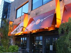 a building with a sign on the front of it at Hôtel Alt Québec in Quebec City