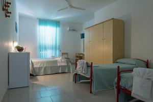 Postel nebo postele na pokoji v ubytování Albergo Marla