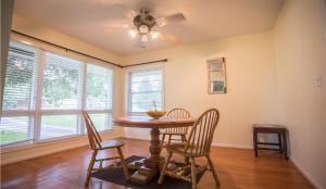 a dining room with a table and chairs and a ceiling fan at The Pineapple Lady 13min to Fort Benning in Columbus