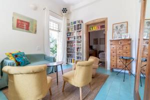 a living room with a couch and chairs and a table at Brand New Gem In Talbiyeh in Jerusalem